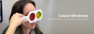 Eye specialist conducting a colour blindness test using red and yellow lenses for diagnosis